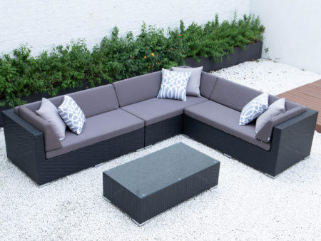 Giant L with glass table in dark grey cushions