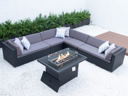 Giant symmetrical L with wicker fire table in dark grey cushions