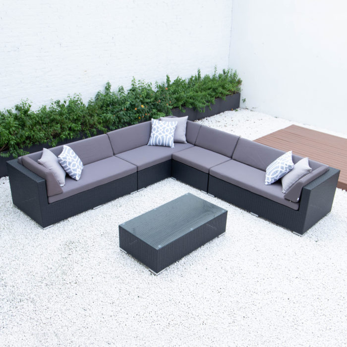 Giant symmetrical L with glass table in dark grey cushions