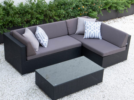 Small L with glass table in dark grey cushions