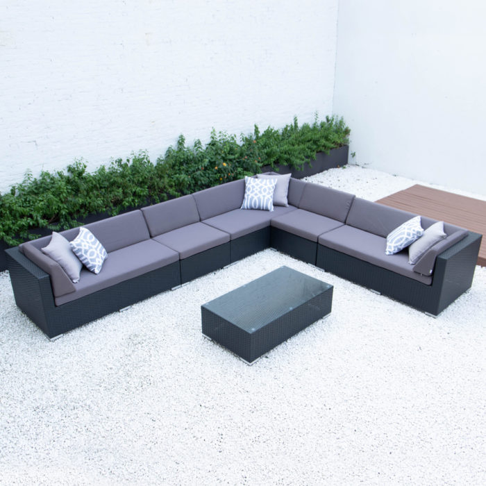 Super Giant L with glass table in dark grey cushions