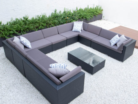Giant u shaped with glass table in dark grey cushions
