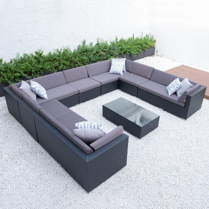 Giant u shaped with glass table in dark grey cushions